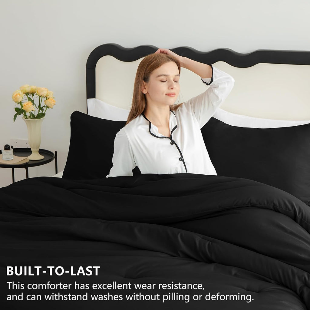 Black Queen-size 3-piece quilted bedding set.