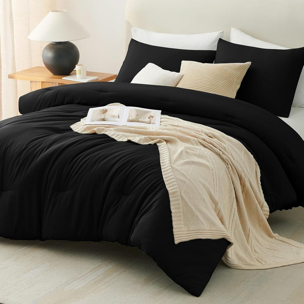 Black Queen-size 3-piece quilted bedding set.